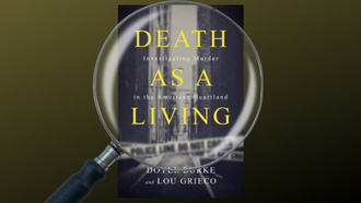 cover of the book death as a living with a magnifying glass over the title